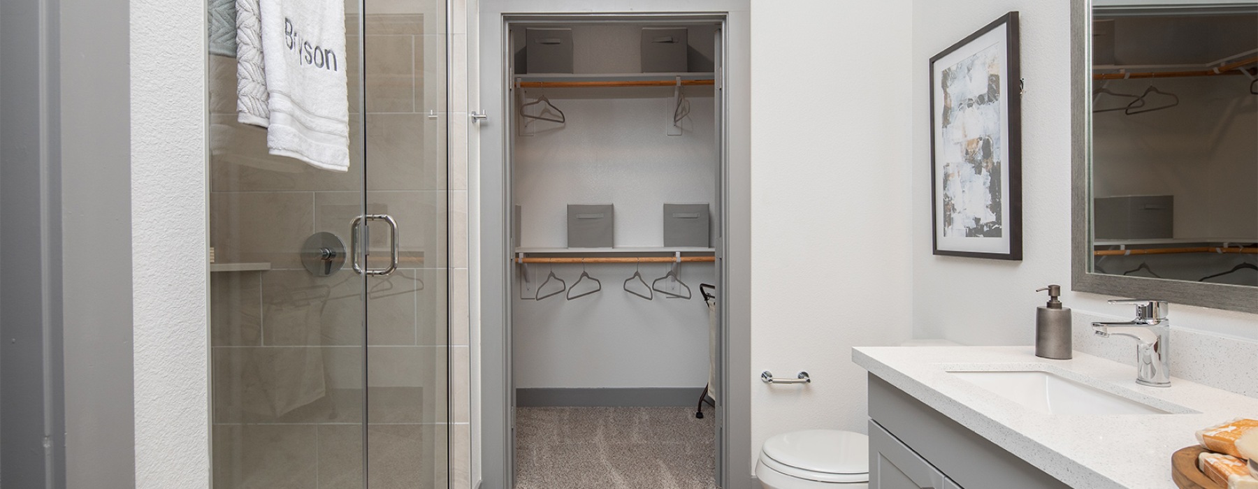 Bathroom with walk-in shower and closet